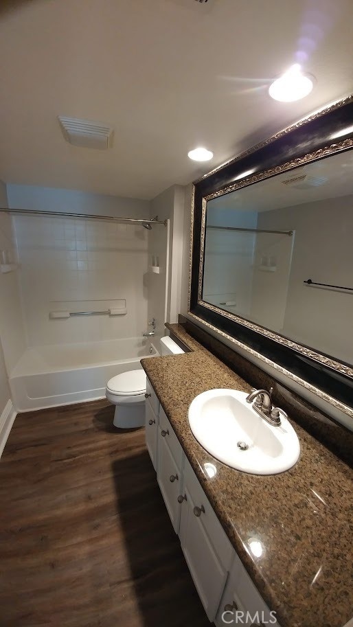 2400 Del Mar Way Unit 206, Corona, CA 92882 - full bath featuring vanity, wood finished floors, shower / bath combination, and toilet