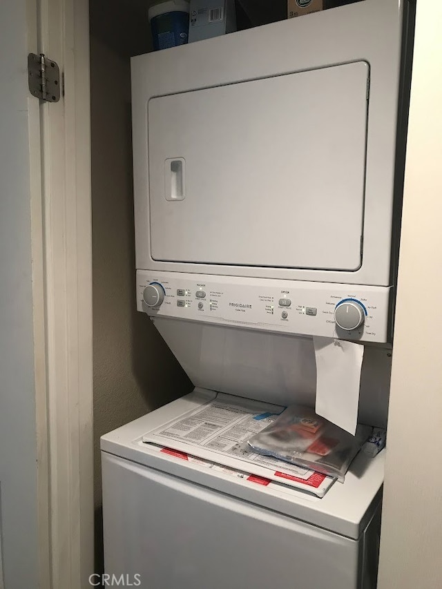 2400 Del Mar Way Unit 206, Corona, CA 92882 - washroom with stacked washer / dryer