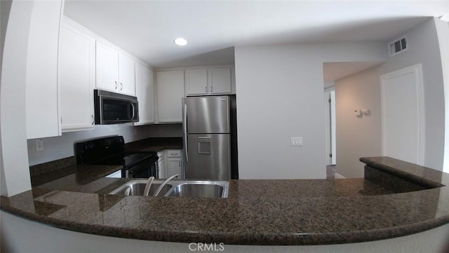 2400 Del Mar Way Unit 206, Corona, CA 92882 - kitchen featuring stainless steel appliances, a sink, dark stone counters, white cabinets, and recessed lighting