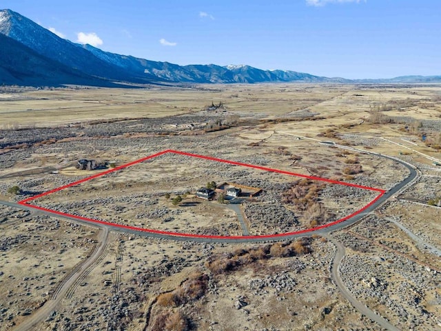 604 River Ranch Rd, Markleeville, CA 96120 - aerial view of sparsely populated area with property parcel outlined, a desert landscape, and a mountain backdrop