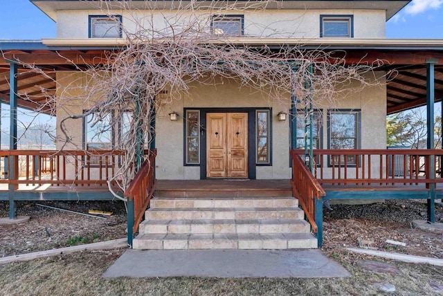 604 River Ranch Rd, Markleeville, CA 96120 - doorway to property with covered porch and stucco siding