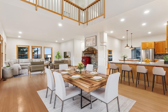 604 River Ranch Rd, Markleeville, CA 96120 - dining area featuring light wood-style flooring, a high ceiling, and recessed lighting