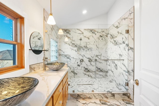 604 River Ranch Rd, Markleeville, CA 96120 - bathroom with marble tiled floors, a marble finish shower, vanity, and vaulted ceiling