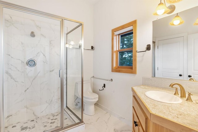 604 River Ranch Rd, Markleeville, CA 96120 - full bathroom with marble look tiles, a marble finish shower, vanity, baseboards, and toilet