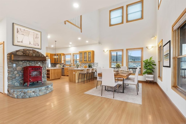 604 River Ranch Rd, Markleeville, CA 96120 - dining space featuring a wood stove, light wood-style flooring, healthy amount of natural light, and recessed lighting
