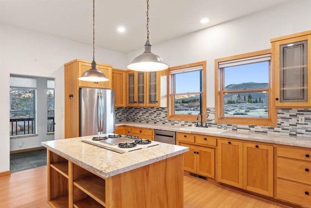 604 River Ranch Rd, Markleeville, CA 96120 - kitchen with appliances with stainless steel finishes, a sink, decorative backsplash, a kitchen island, and recessed lighting