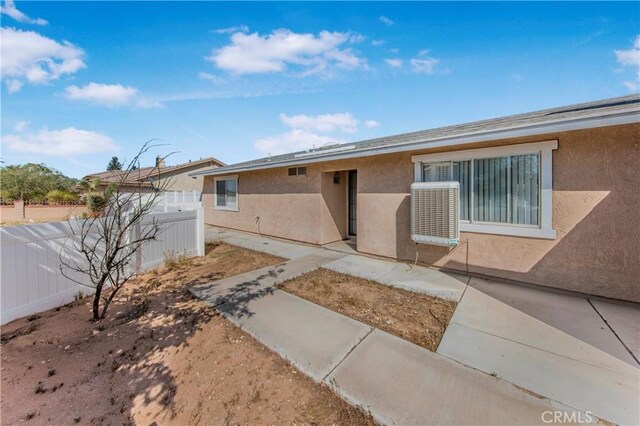 14317 Jicarilla Rd, Apple Valley, CA 92307 - view of front facade featuring stucco siding and a patio area