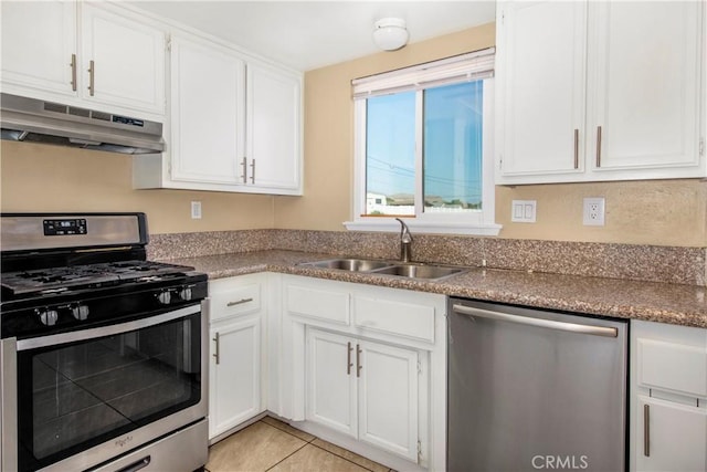 14317 Jicarilla Rd, Apple Valley, CA 92307 - kitchen featuring appliances with stainless steel finishes, under cabinet range hood, a sink, and white cabinets