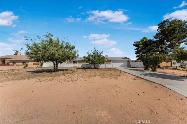 14317 Jicarilla Rd, Apple Valley, CA 92307 - obstructed view of property with driveway and an attached garage