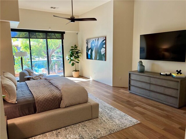 50135 Camino Privado Ln, Quinta, CA 92253 - bedroom featuring wood finished floors, access to outside, and a ceiling fan