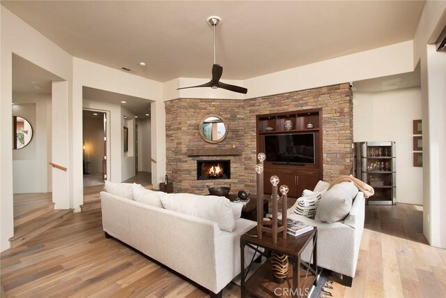 50135 Camino Privado Ln, Quinta, CA 92253 - living area featuring a ceiling fan, a fireplace, and wood finished floors