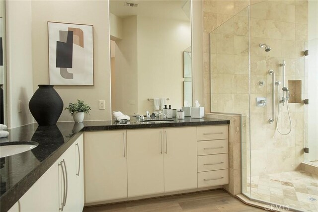 50135 Camino Privado Ln, Quinta, CA 92253 - full bath featuring a stall shower, double vanity, and wood finished floors