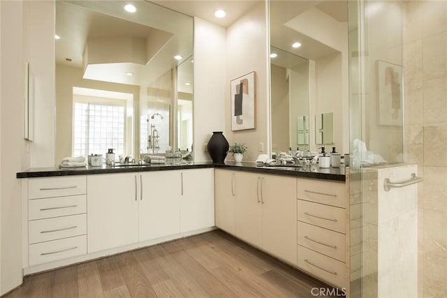 50135 Camino Privado Ln, Quinta, CA 92253 - bathroom with double vanity, tiled shower, and wood finished floors