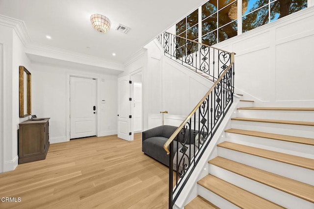2060 Windover Rd, Pasadena, CA 91107 - entrance foyer featuring stairway, ornamental molding, light wood-type flooring, and baseboards