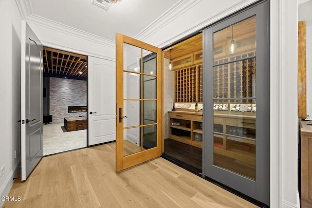 2060 Windover Rd, Pasadena, CA 91107 - wine room featuring light wood-style floors and crown molding