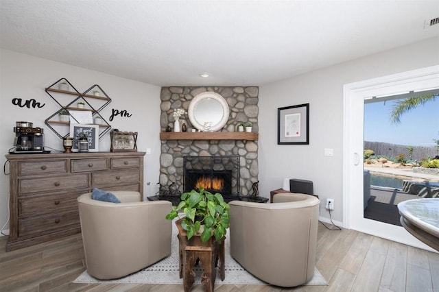 29730 Red Mountain Rd, Valley Center, CA 92082 - living area with a fireplace, wood finished floors, and baseboards