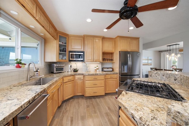 29730 Red Mountain Rd, Valley Center, CA 92082 - kitchen featuring appliances with stainless steel finishes, a sink, healthy amount of natural light, light wood finished floors, and recessed lighting