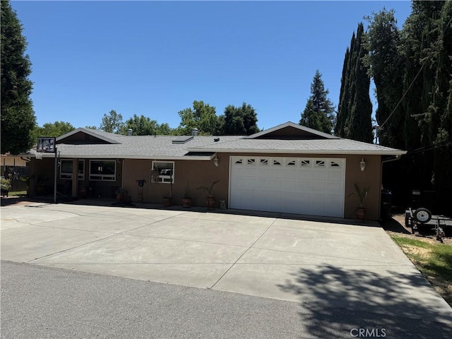 7580 San Andres, San Andres, CA 93422 - ranch-style house with an attached garage, driveway, and stucco siding