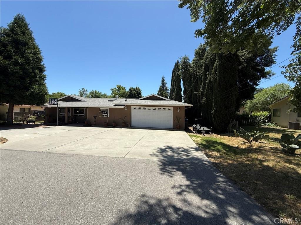 7580 San Andres, San Andres, CA 93422 - ranch-style house with concrete driveway, a garage, and stucco siding
