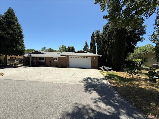 7580 San Andres, San Andres, CA 93422 - ranch-style house with concrete driveway, a garage, and stucco siding