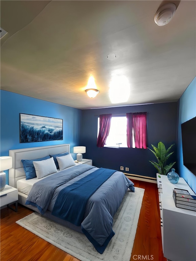 3817 Somerset Dr, Los Angeles, CA 90008 - bedroom with wood finished floors and baseboard heating