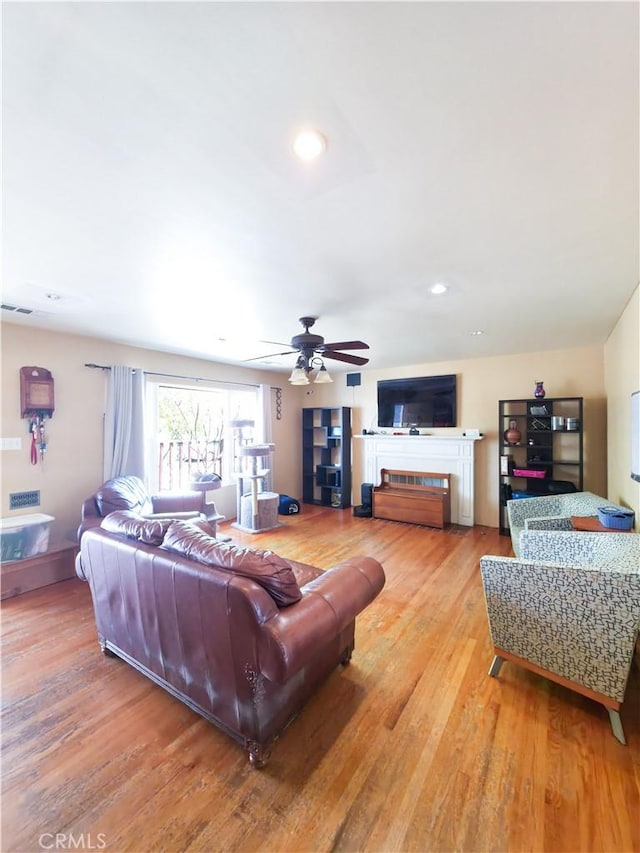 3817 Somerset Dr, Los Angeles, CA 90008 - living area featuring ceiling fan, light wood-type flooring, a fireplace, and recessed lighting