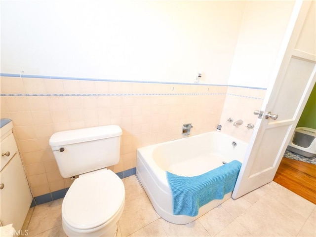 3817 Somerset Dr, Los Angeles, CA 90008 - full bathroom featuring a garden tub, wainscoting, toilet, vanity, and tile walls