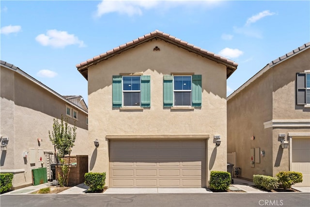 16007 Dexter St, Chino, CA 91708 - view of front of home with stucco siding, a garage, a tiled roof, and driveway