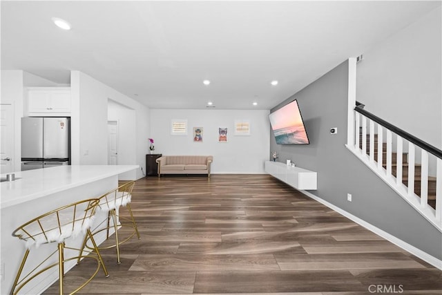 16007 Dexter St, Chino, CA 91708 - living area with dark wood-type flooring, recessed lighting, and stairs