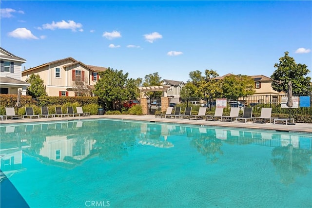 16007 Dexter St, Chino, CA 91708 - community pool with a pergola and a residential view