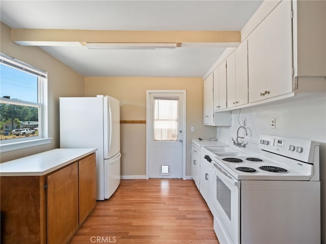 16183 18th Ave, Clearlake, CA 95422 - kitchen featuring white appliances, healthy amount of natural light, light wood finished floors, and light countertops