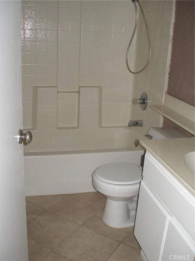 12975 Stanford Dr, Victorville, CA 92392 - full bathroom featuring tile patterned floors, toilet, washtub / shower combination, and vanity