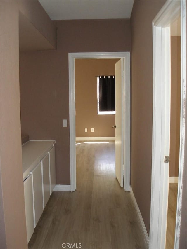 12975 Stanford Dr, Victorville, CA 92392 - corridor with light wood finished floors and baseboards