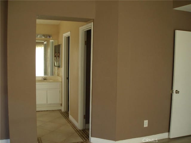 12975 Stanford Dr, Victorville, CA 92392 - hallway featuring baseboards and light tile patterned flooring