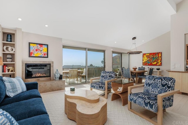 12812 Caminito En Flor, Del Mar, CA 92014 - living room with a high end fireplace, lofted ceiling, recessed lighting, and light wood-style floors
