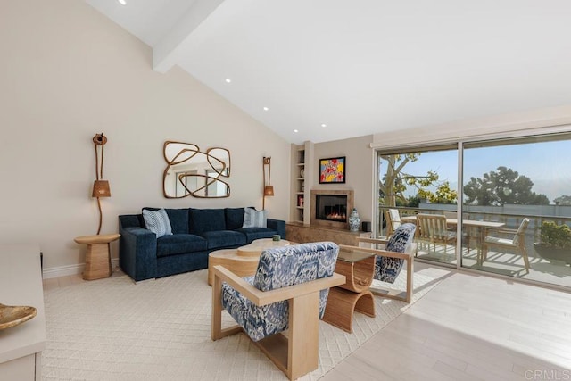 12812 Caminito En Flor, Del Mar, CA 92014 - living area with beam ceiling, a tiled fireplace, baseboards, high vaulted ceiling, and built in features