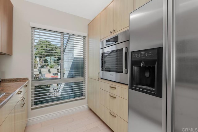 12812 Caminito En Flor, Del Mar, CA 92014 - kitchen with appliances with stainless steel finishes, light brown cabinetry, and baseboards