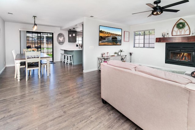 23912 Benito Way, Ramona, CA 92065 - living area with wood finished floors, a ceiling fan, and a glass covered fireplace