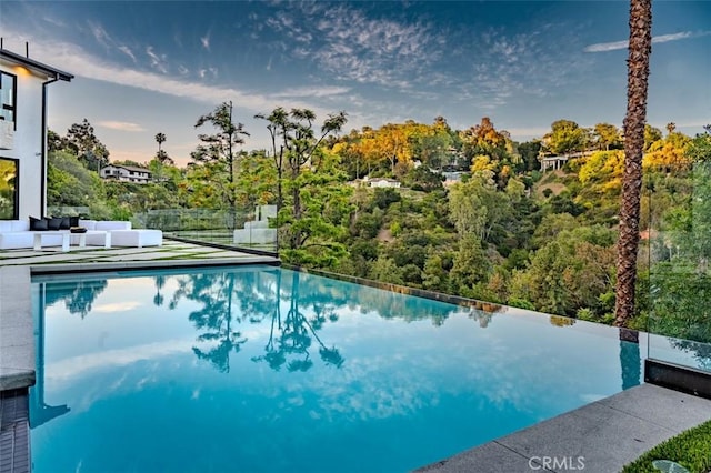 2608 Zorada Dr, Los Angeles, CA 90046 - view of swimming pool with an infinity pool and an outdoor living space