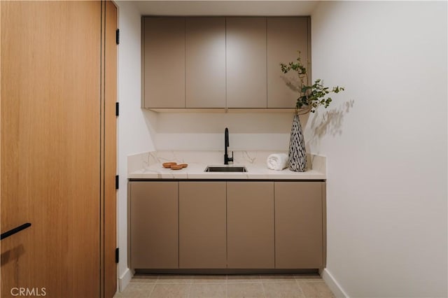 2608 Zorada Dr, Los Angeles, CA 90046 - bar area featuring a sink, baseboards, and light tile patterned floors