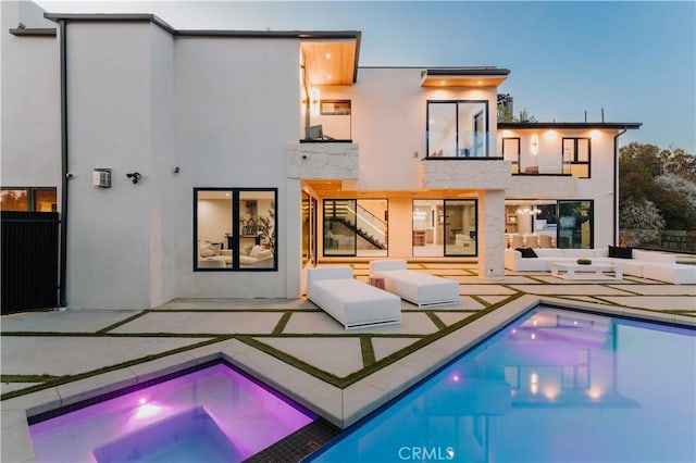 2608 Zorada Dr, Los Angeles, CA 90046 - back of house with an in-ground hot tub, a patio area, a balcony, and stucco siding