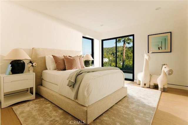 2608 Zorada Dr, Los Angeles, CA 90046 - bedroom featuring light wood-style flooring