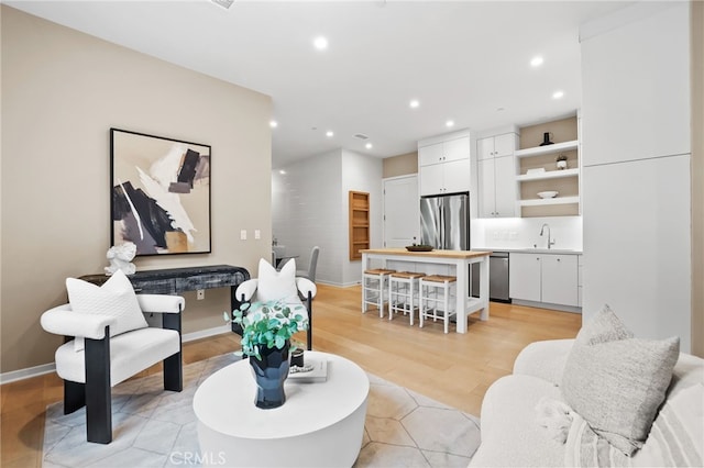 108 Coastal Gdn, Irvine, CA 92618 - living area featuring recessed lighting, light wood-style floors, and baseboards