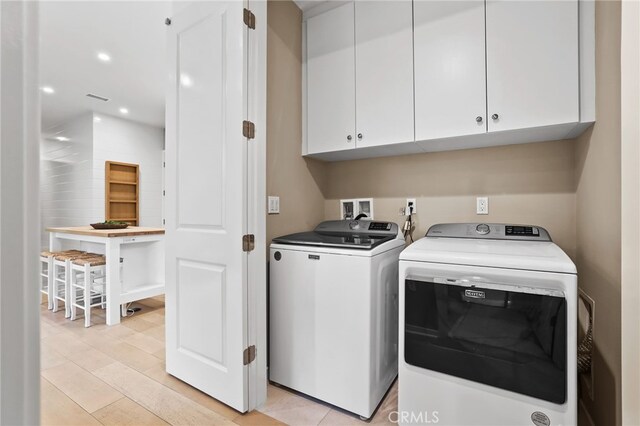108 Coastal Gdn, Irvine, CA 92618 - laundry room featuring cabinet space, washing machine and clothes dryer, and recessed lighting