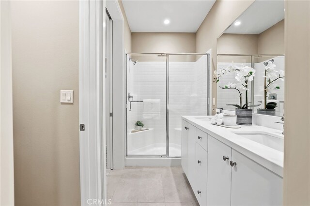 108 Coastal Gdn, Irvine, CA 92618 - full bathroom with a shower stall, double vanity, tile patterned floors, and recessed lighting