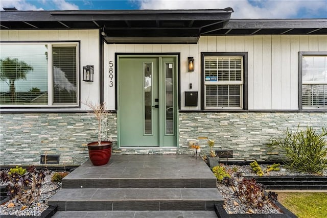 5893 E Adderley Dr, Long Beach, CA 90808 - entrance to property with stone siding and a porch