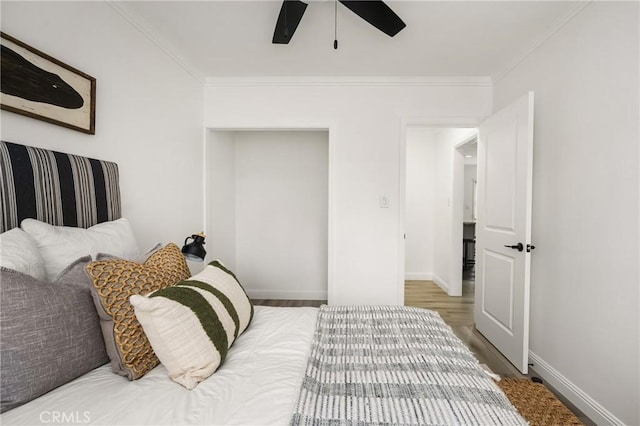 5893 E Adderley Dr, Long Beach, CA 90808 - bedroom with ornamental molding, wood finished floors, baseboards, and ceiling fan