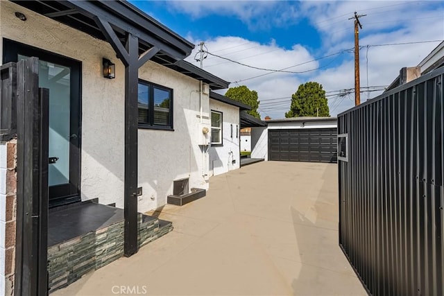5893 E Adderley Dr, Long Beach, CA 90808 - view of patio / terrace with an outbuilding and a garage