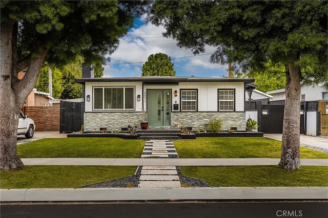 5893 E Adderley Dr, Long Beach, CA 90808 - view of front facade with stone siding, a gate, and a chimney