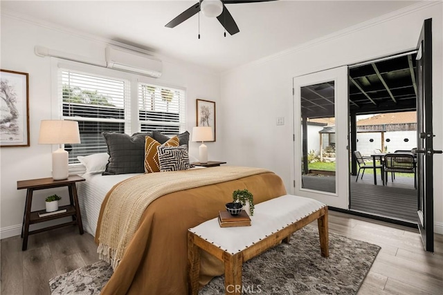 5893 E Adderley Dr, Long Beach, CA 90808 - bedroom featuring a wall mounted AC, access to outside, ornamental molding, wood finished floors, and ceiling fan